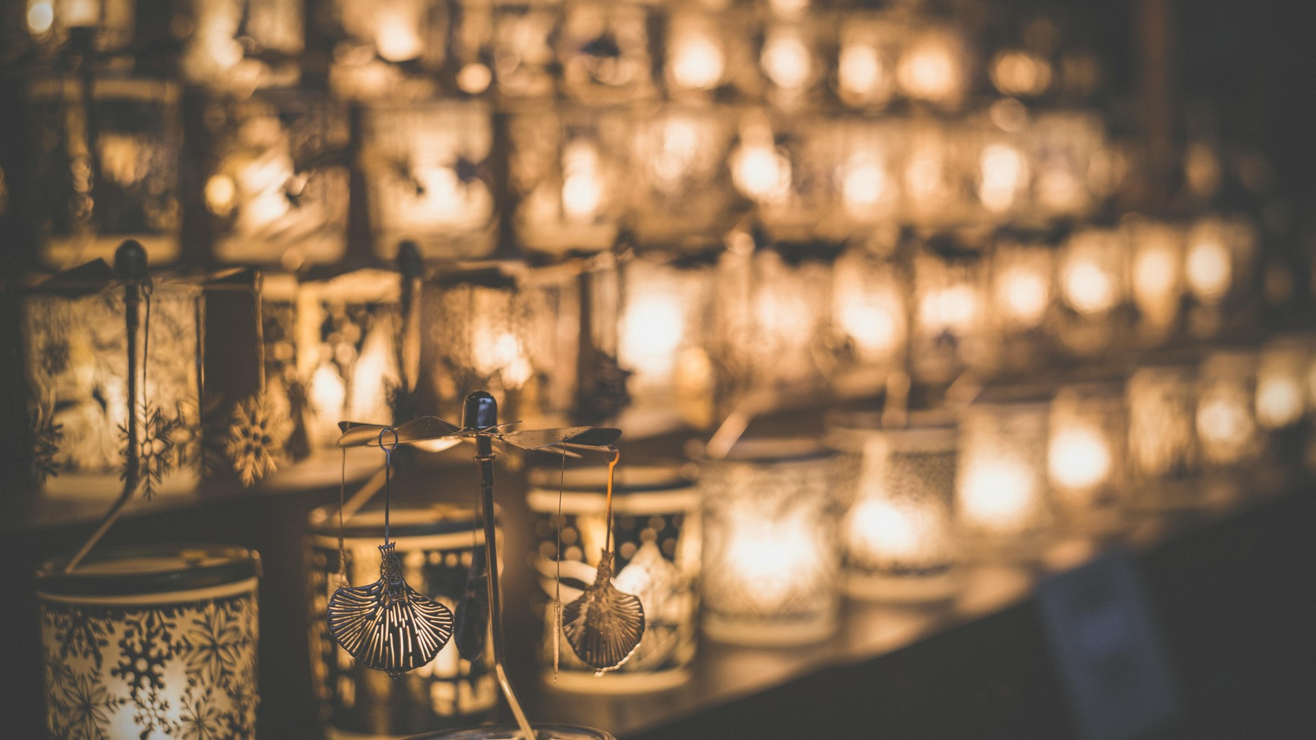 Clear Glass Candle Holder on Brown Wooden Table
