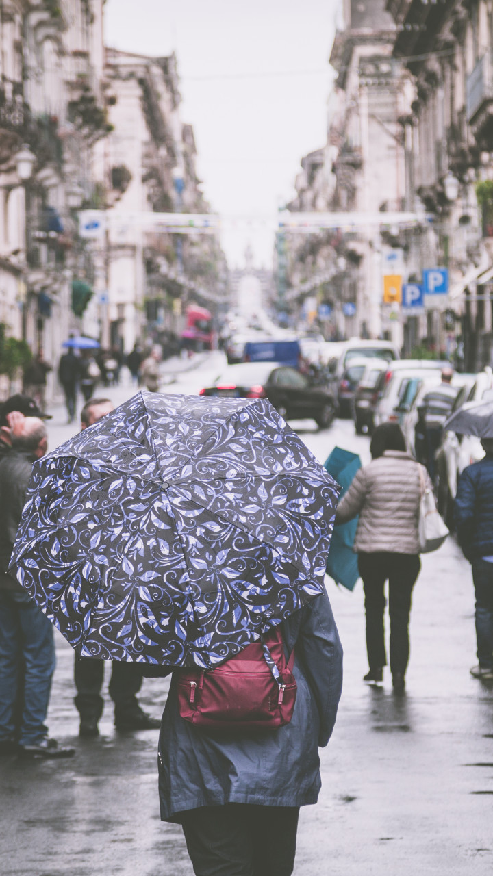 Woman Holding Umbrella