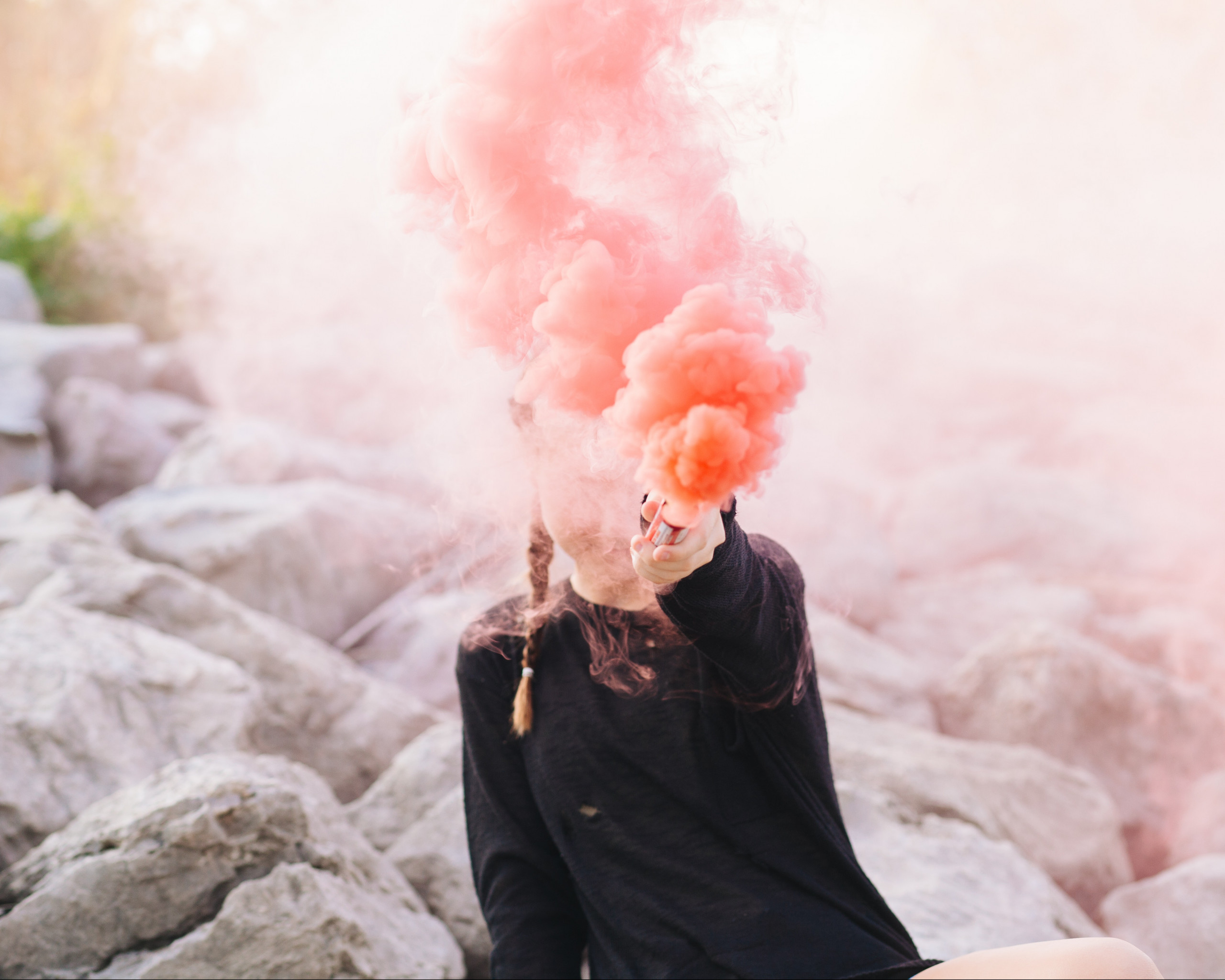 Woman Holding Color Smoke Grenade