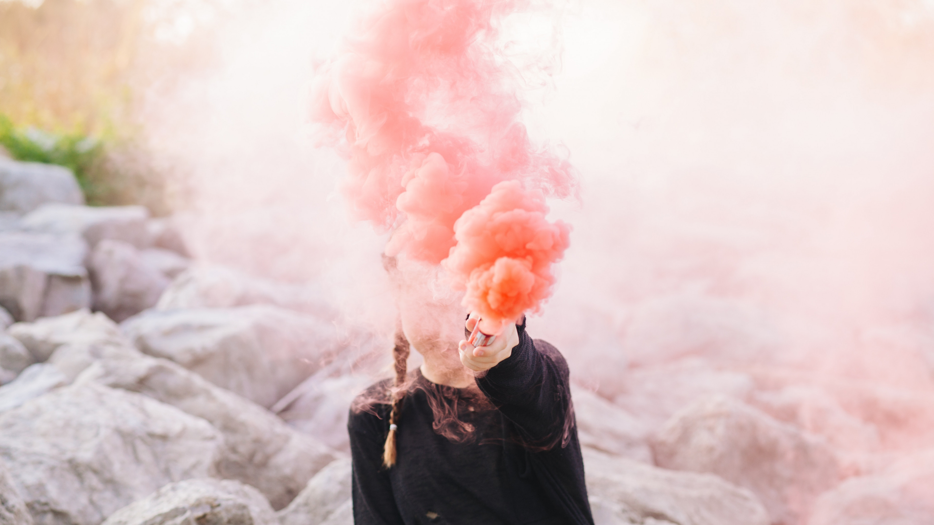 Woman Holding Color Smoke Grenade