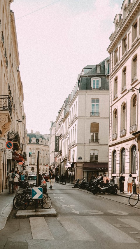 People Walking on Sidewalk Near Buildings