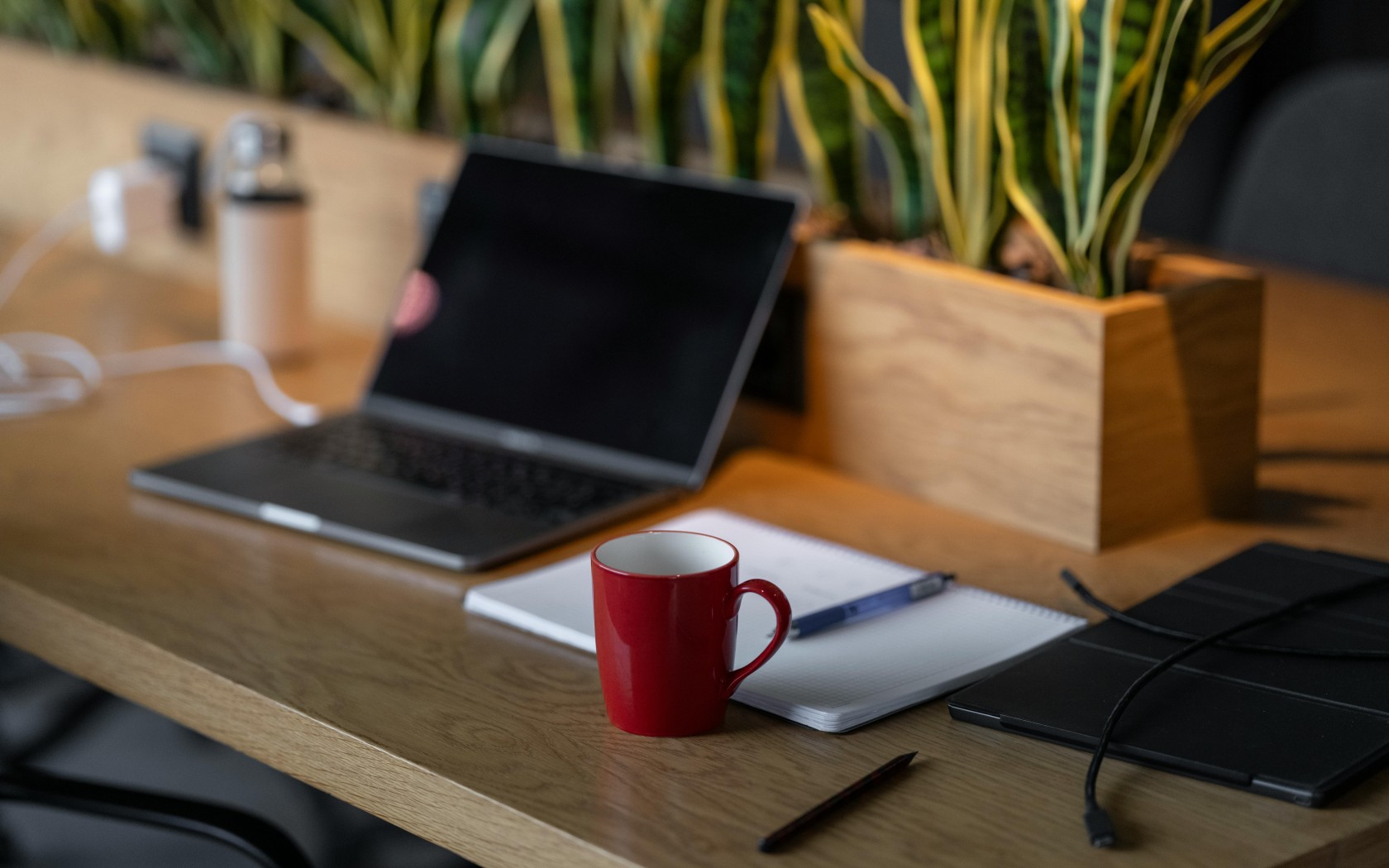 Mug, Notebook and Laptop on Table