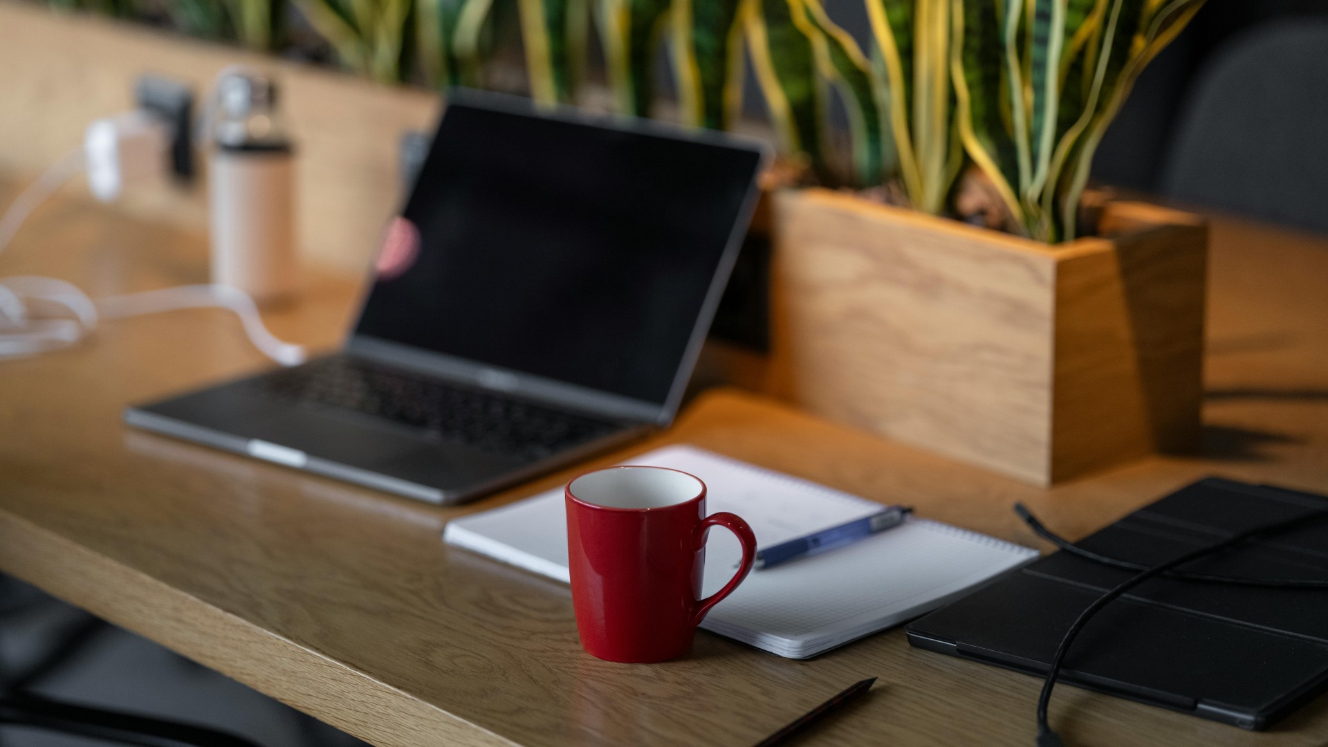 Mug, Notebook and Laptop on Table