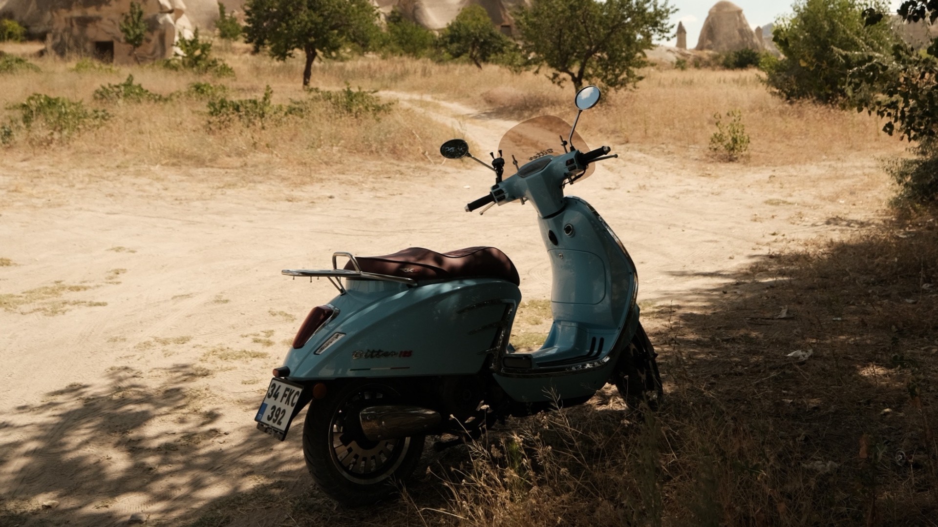 Motorcycle Parked on Brown Sand