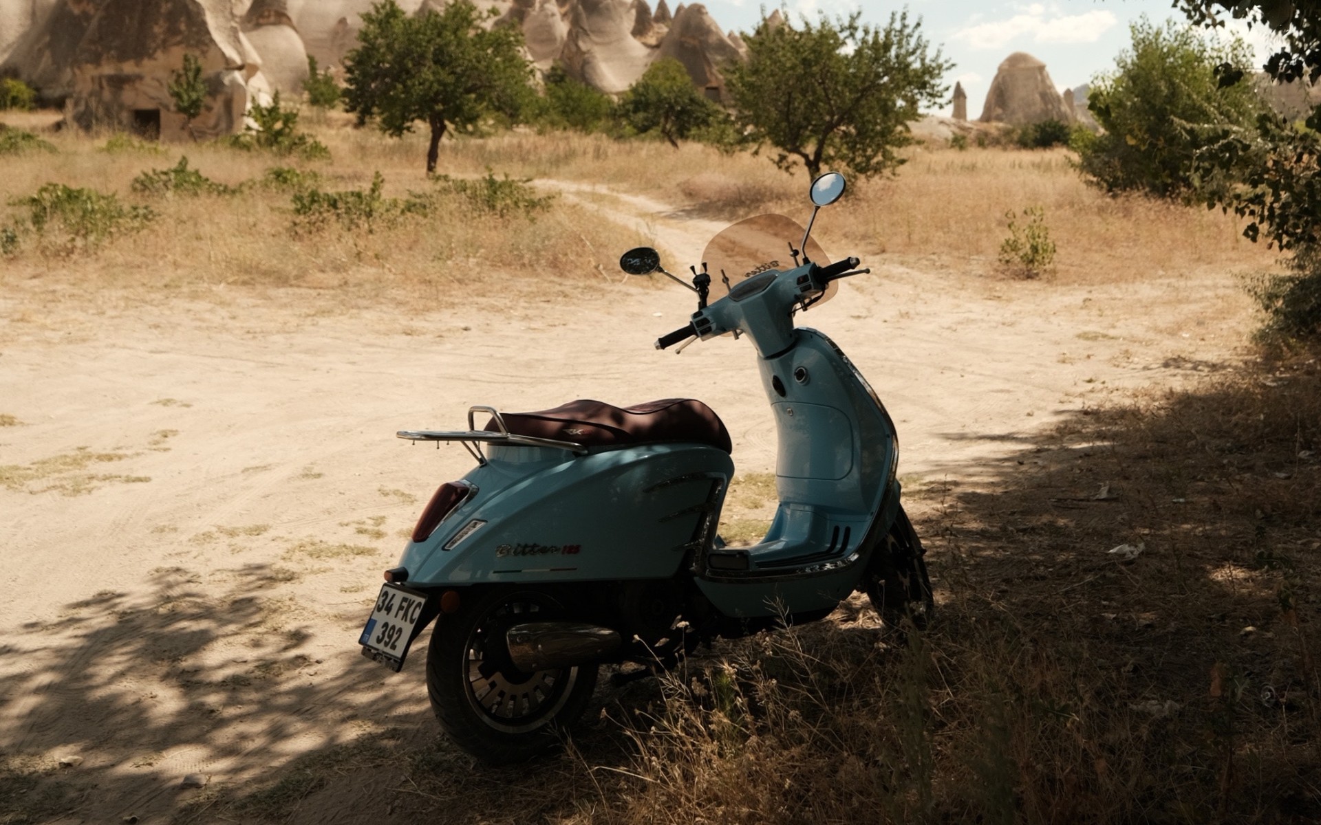 Motorcycle Parked on Brown Sand