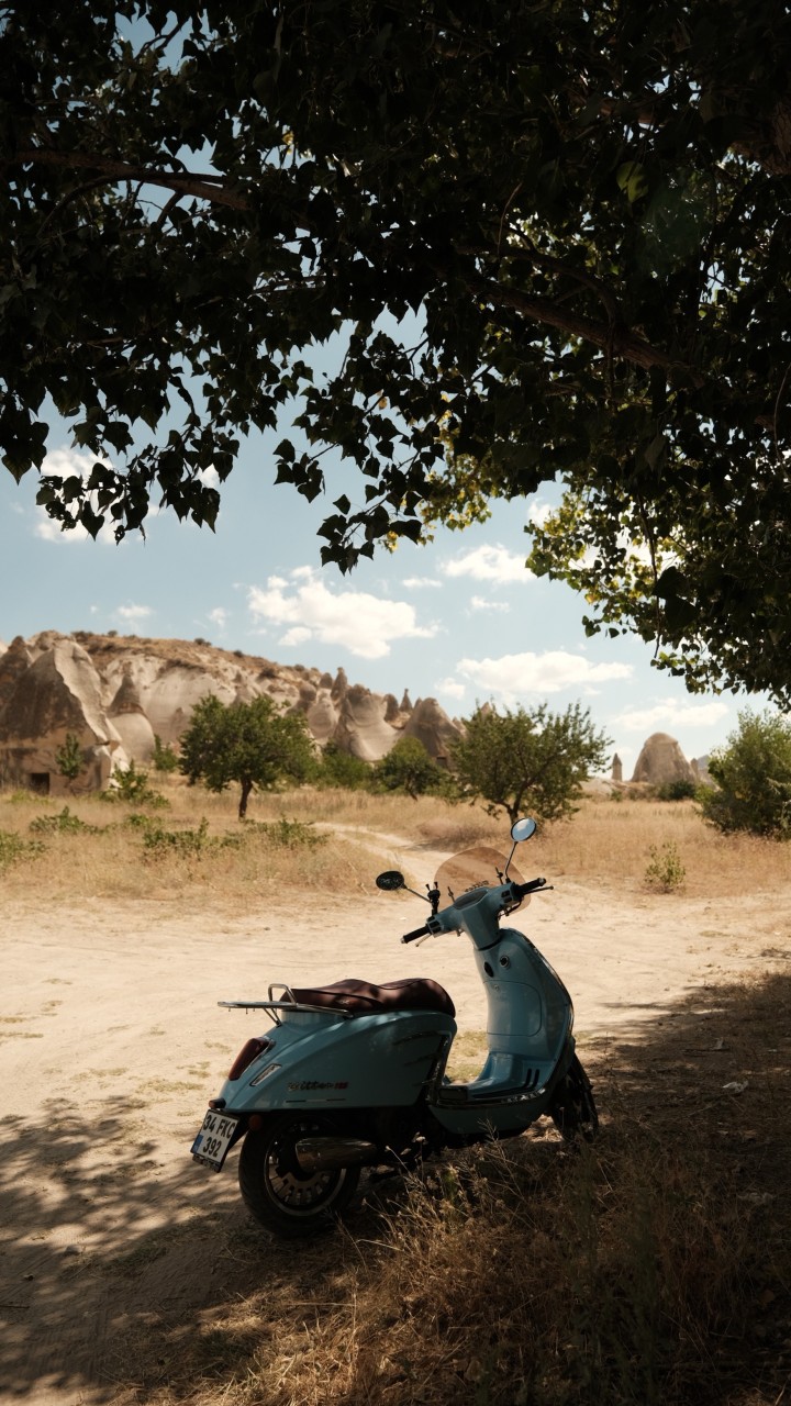 Motorcycle Parked on Brown Sand