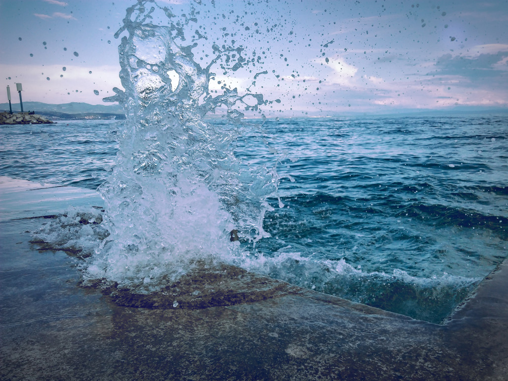 Water Smashing On Concrete Pavement