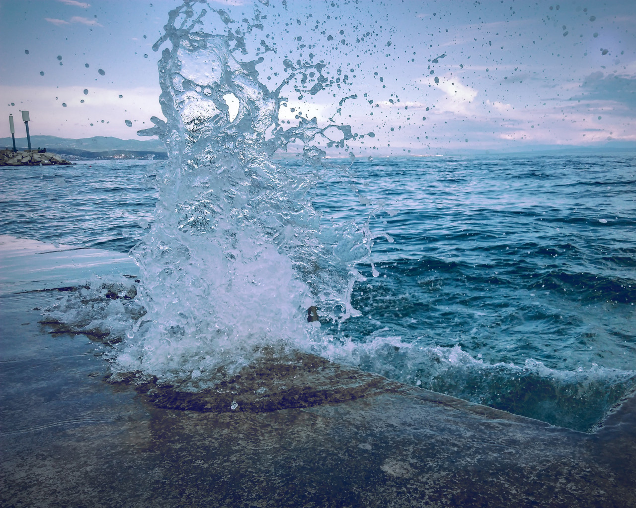 Water Smashing On Concrete Pavement