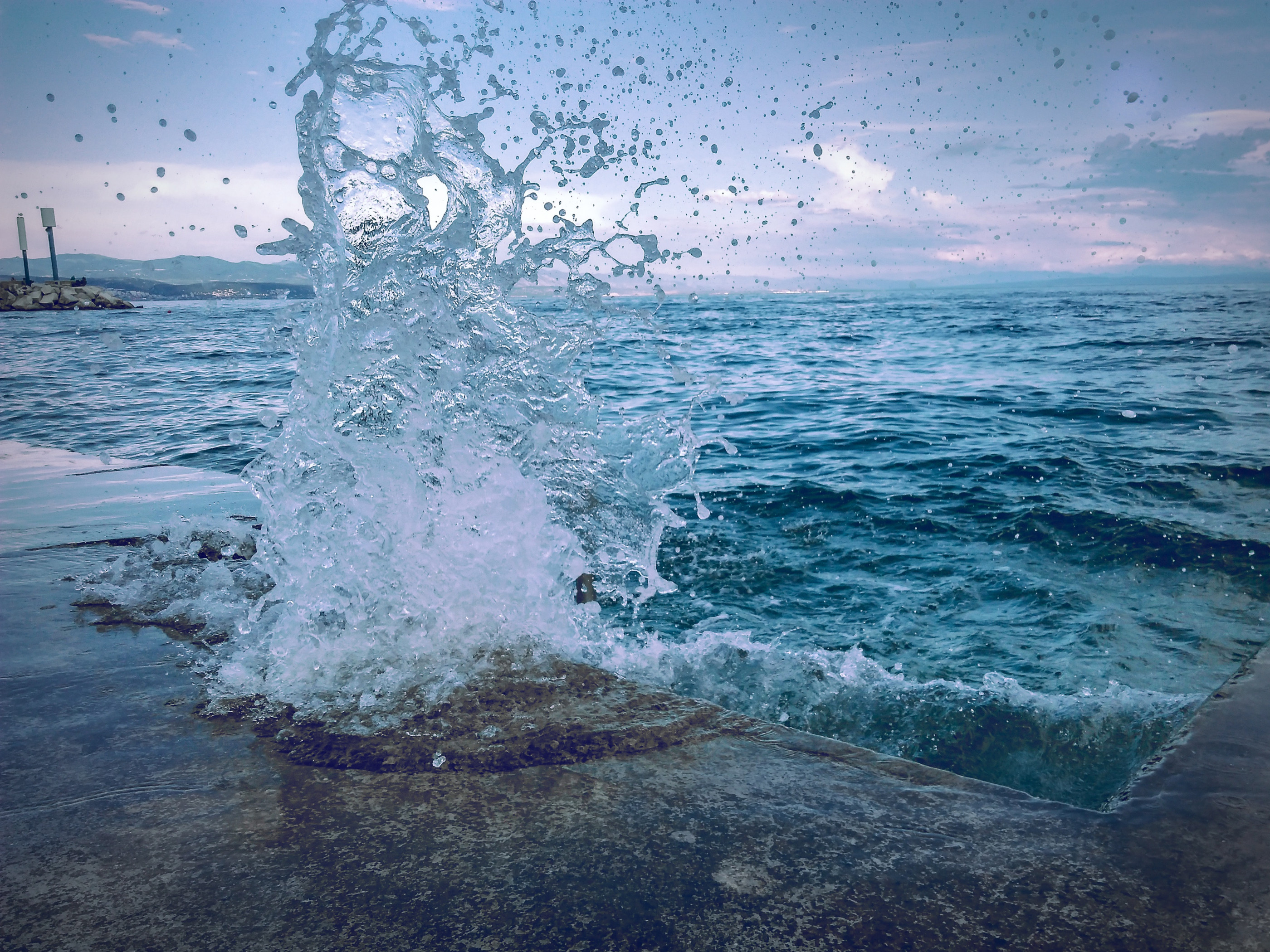Water Smashing On Concrete Pavement