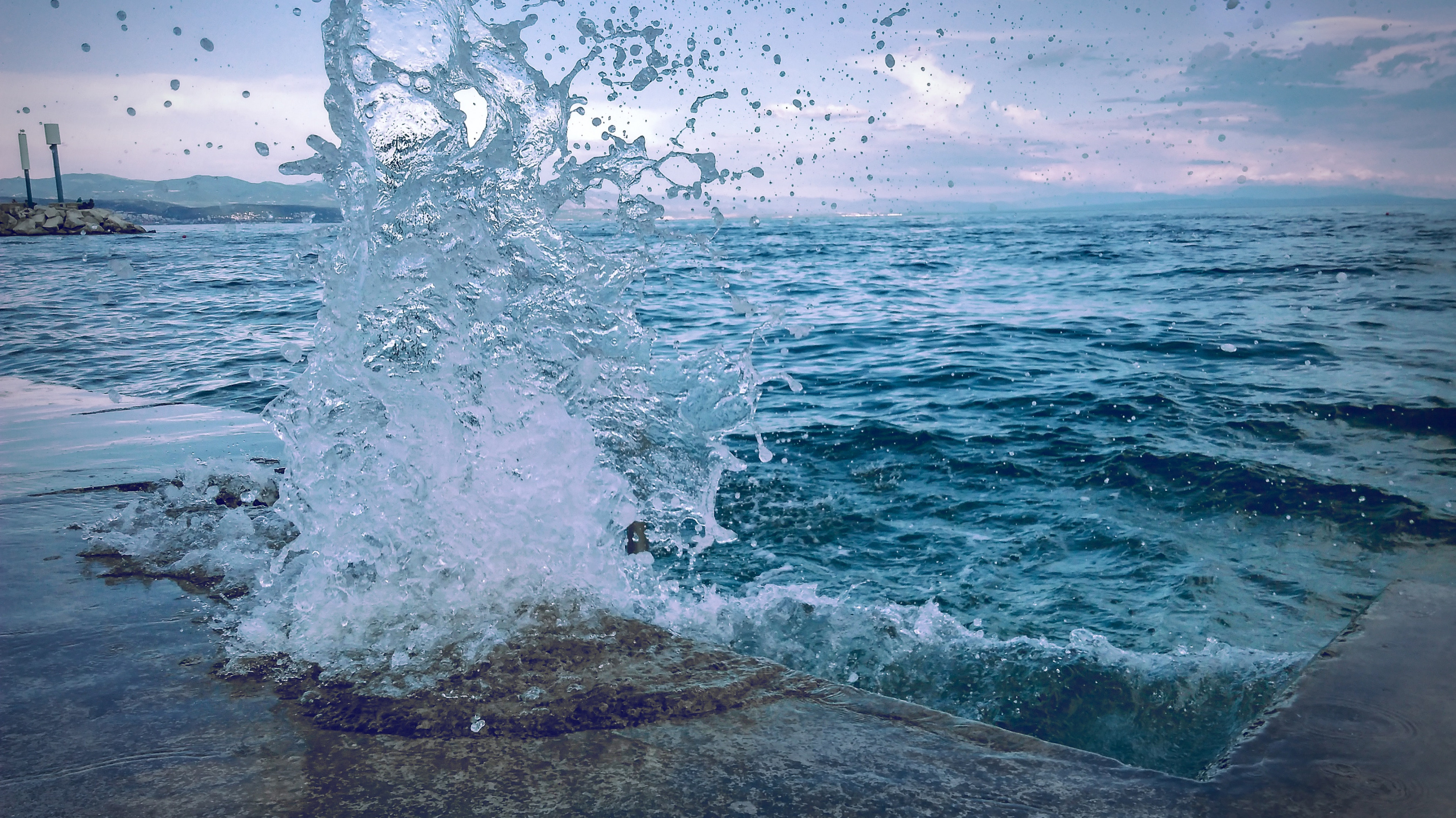 Water Smashing On Concrete Pavement