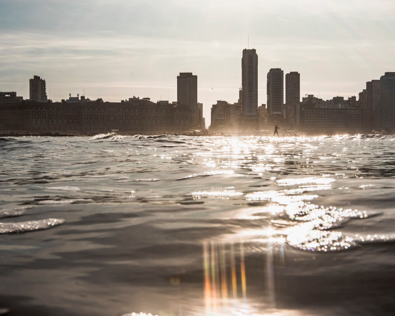 City Skyline Across Water at Sunset