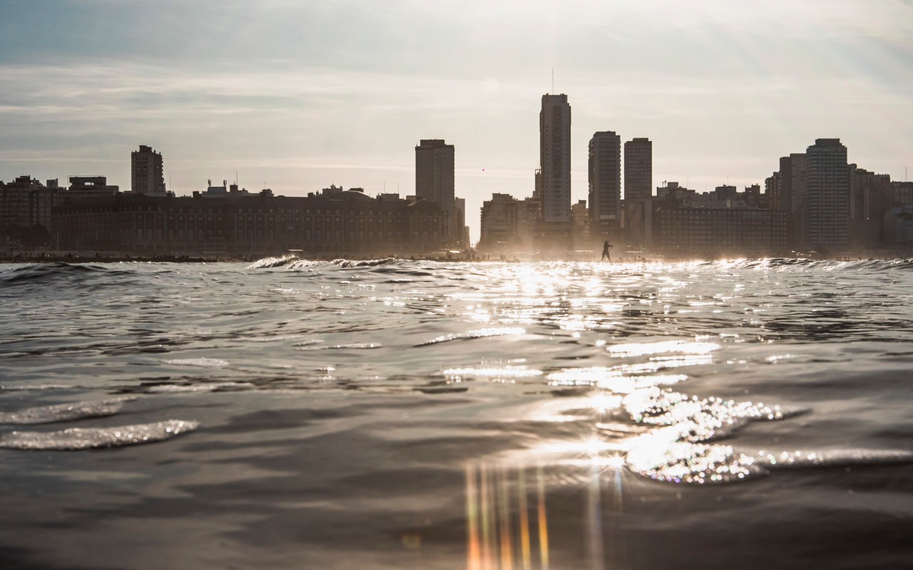 City Skyline Across Water at Sunset