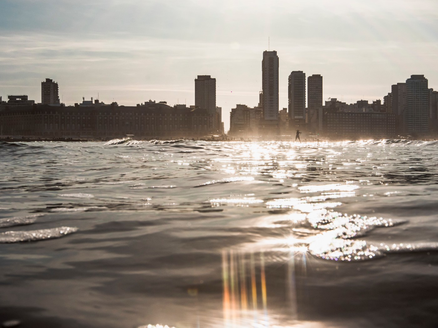 City Skyline Across Water at Sunset