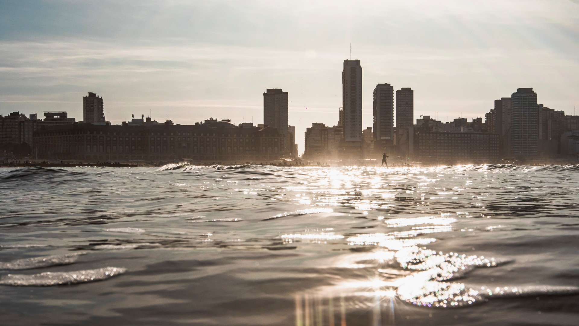 City Skyline Across Water at Sunset