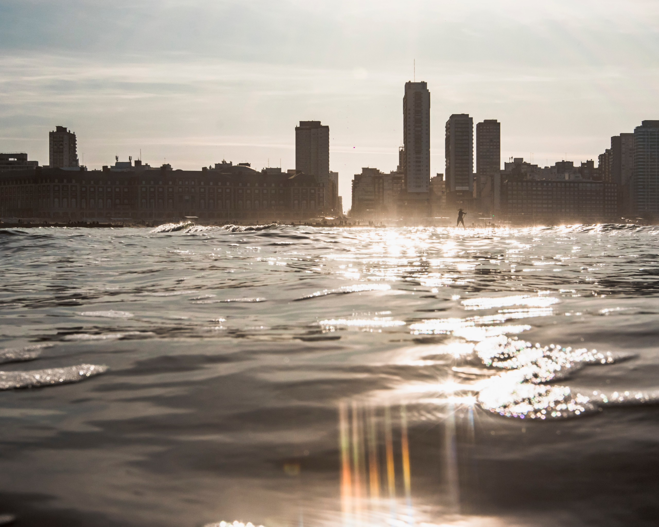 City Skyline Across Water at Sunset