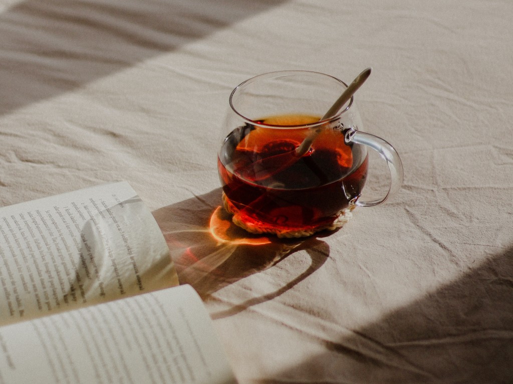 Book and Tea on Bed