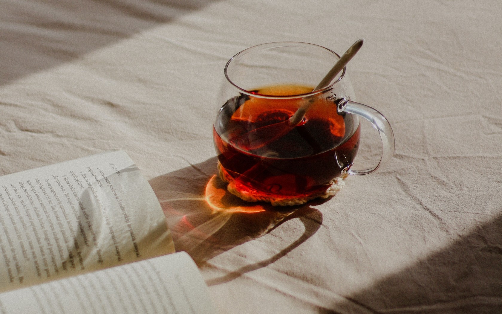 Book and Tea on Bed