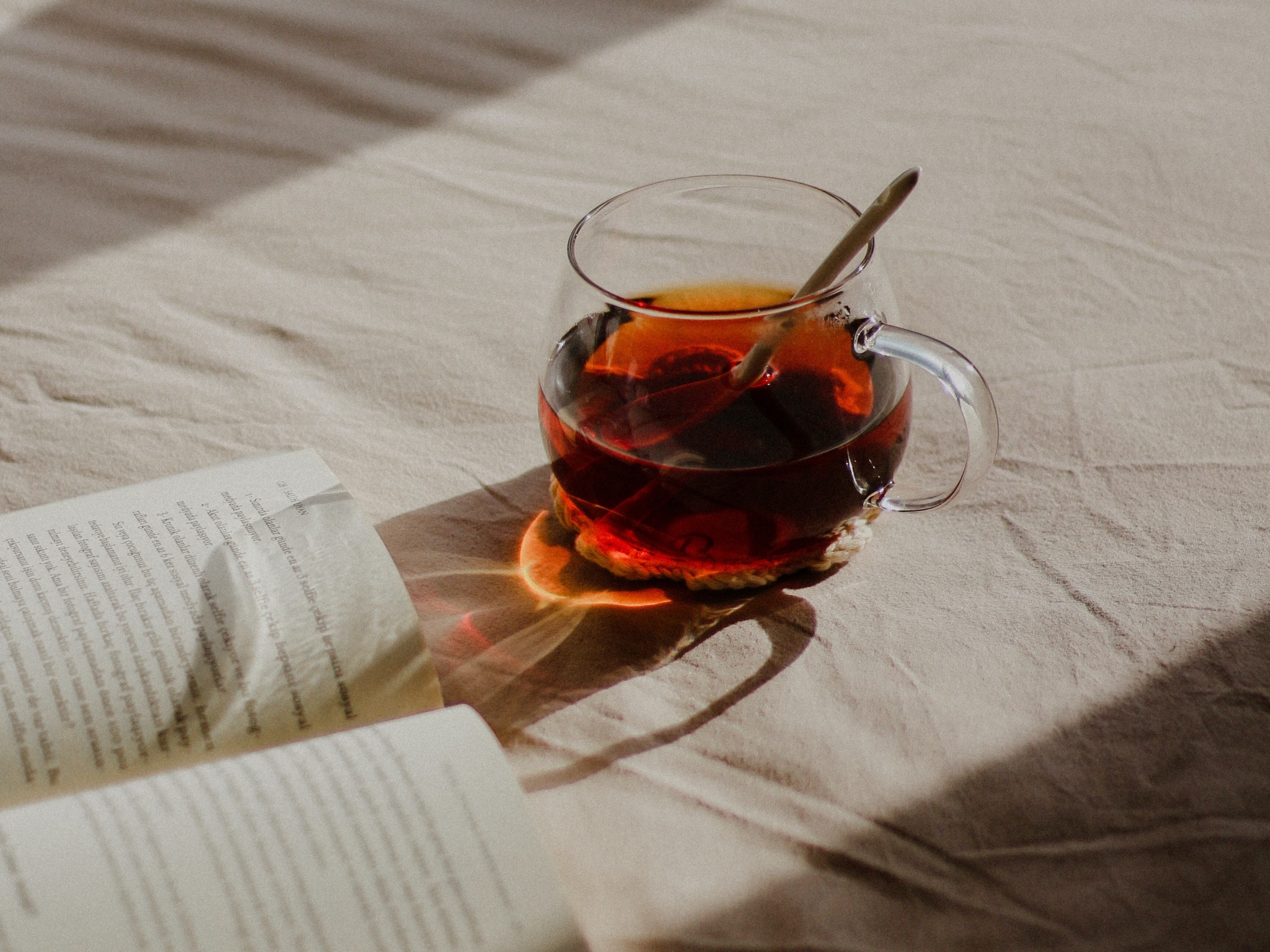 Book and Tea on Bed