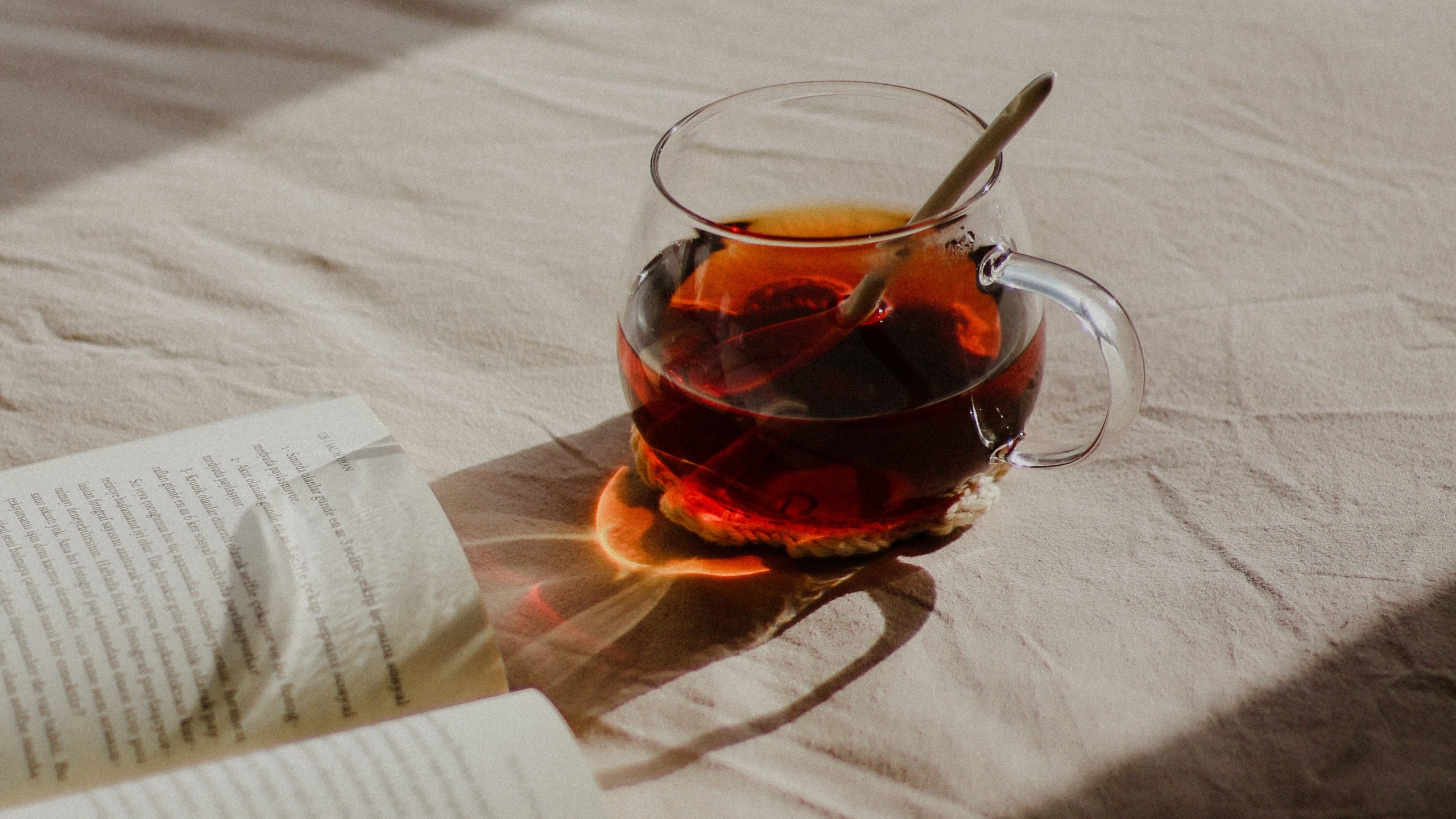 Book and Tea on Bed