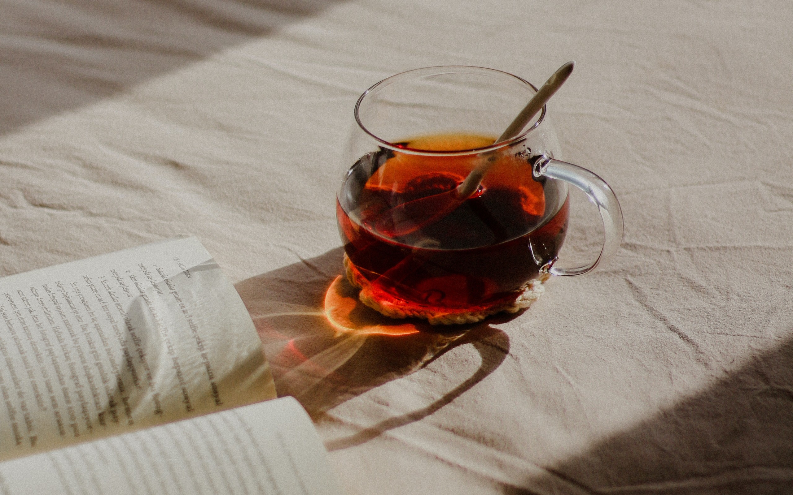 Book and Tea on Bed