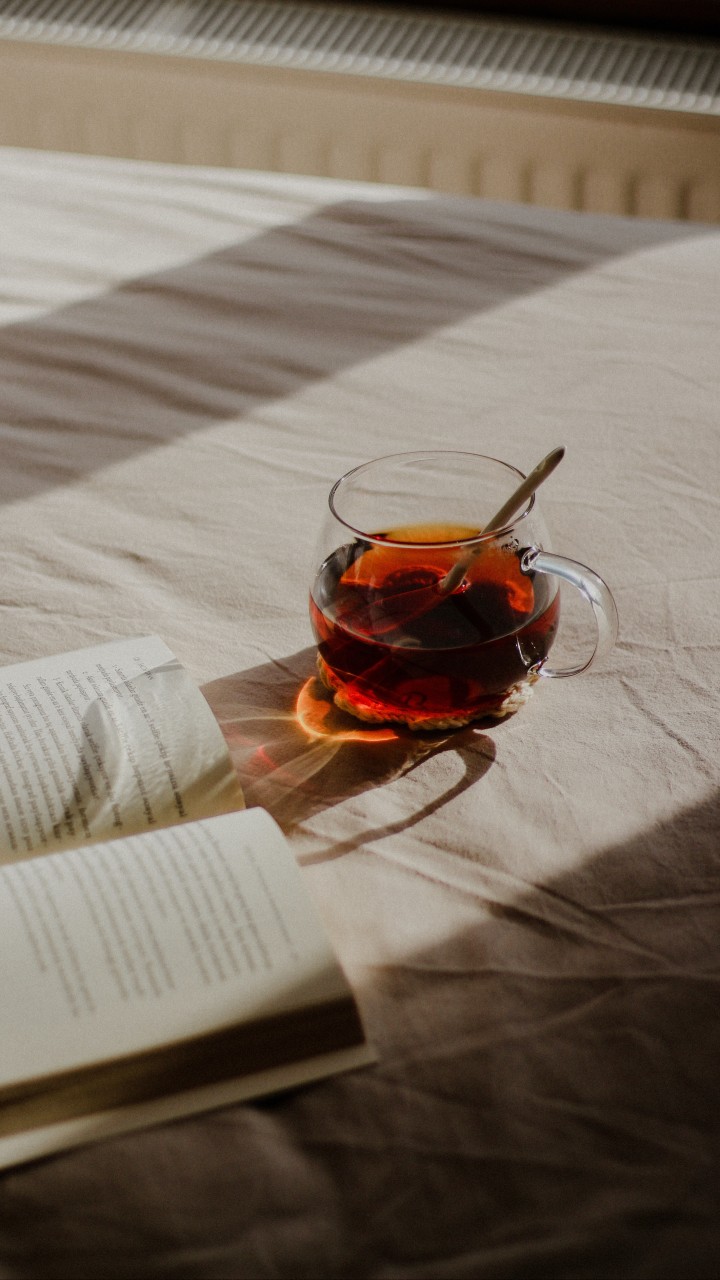 Book and Tea on Bed