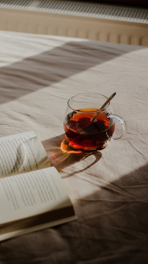 Book and Tea on Bed