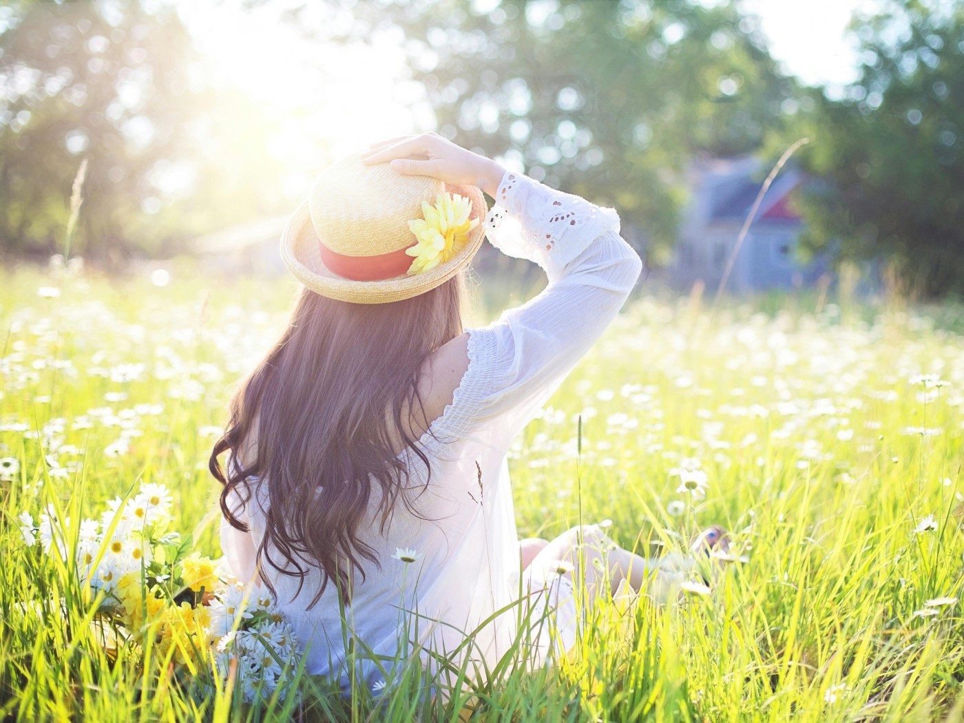 A Woman Sitting in the Flower Feld