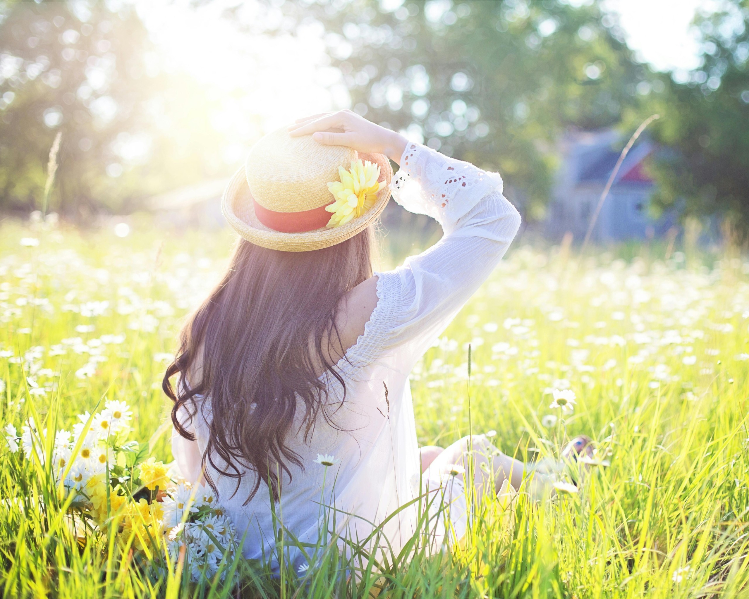 A Woman Sitting in the Flower Feld