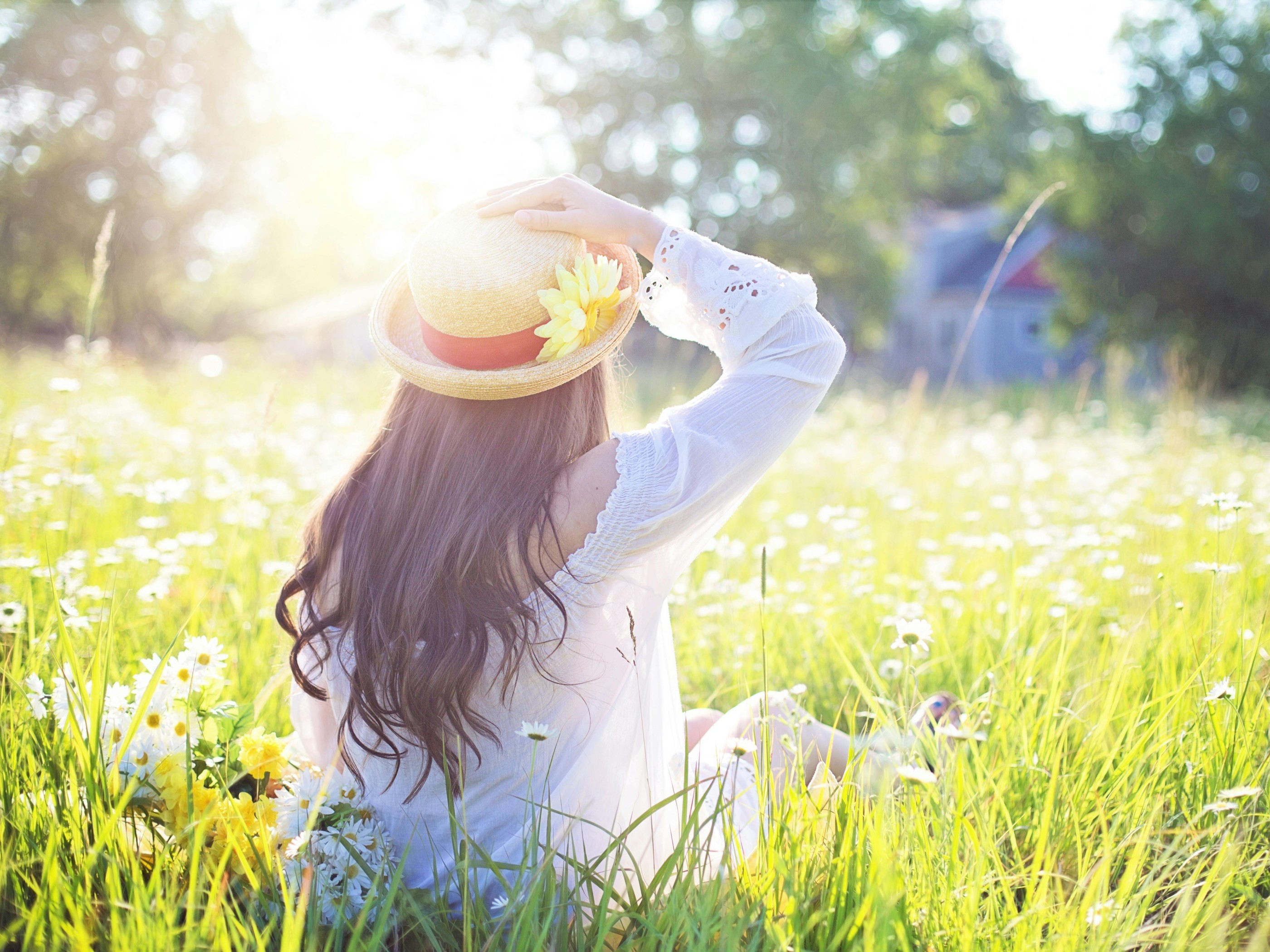 A Woman Sitting in the Flower Feld