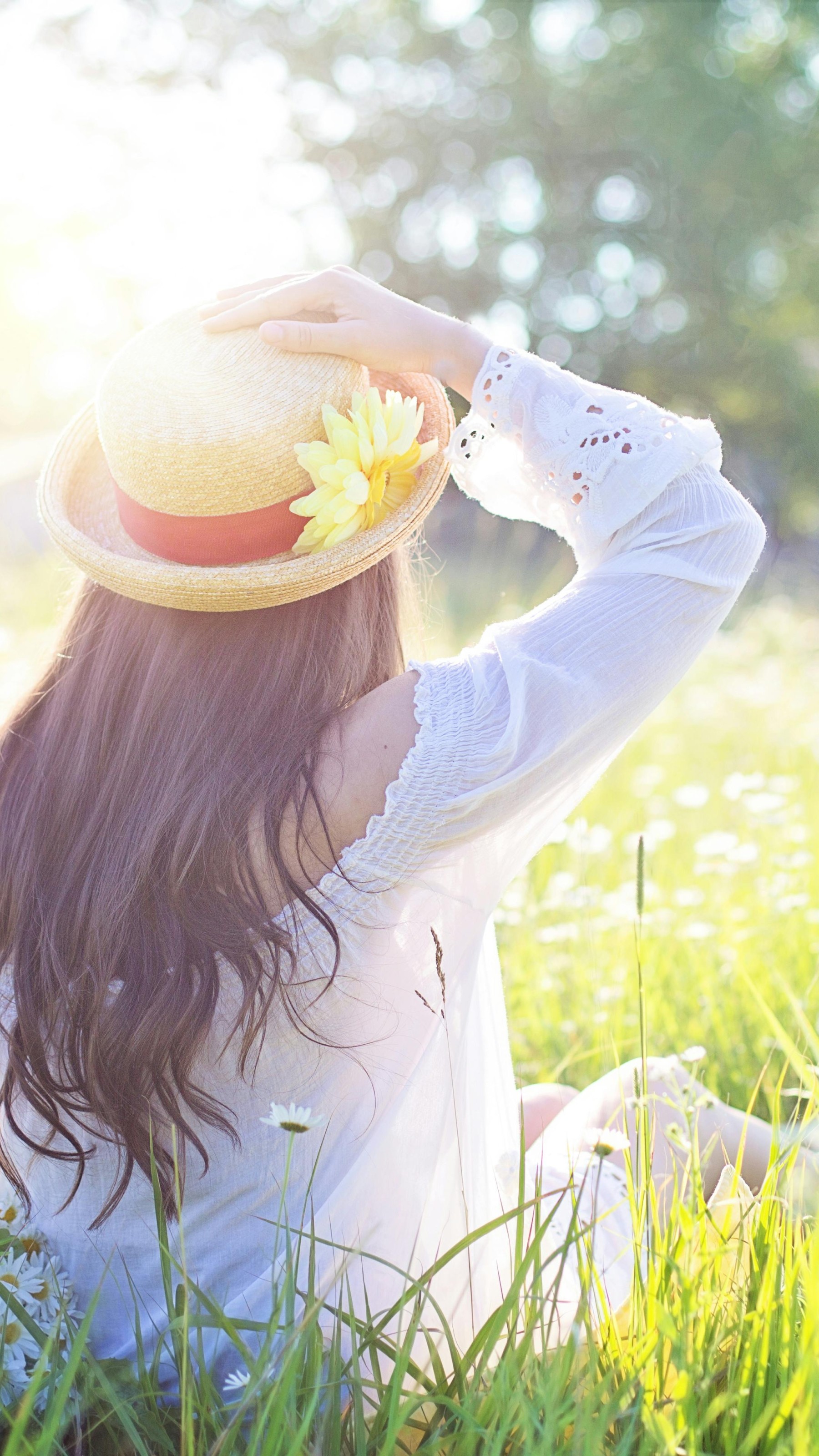 A Woman Sitting in the Flower Feld