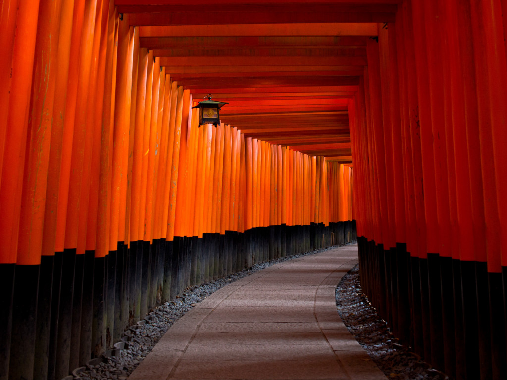 Gray Concrete Pathway Between Red-and-black Pillars