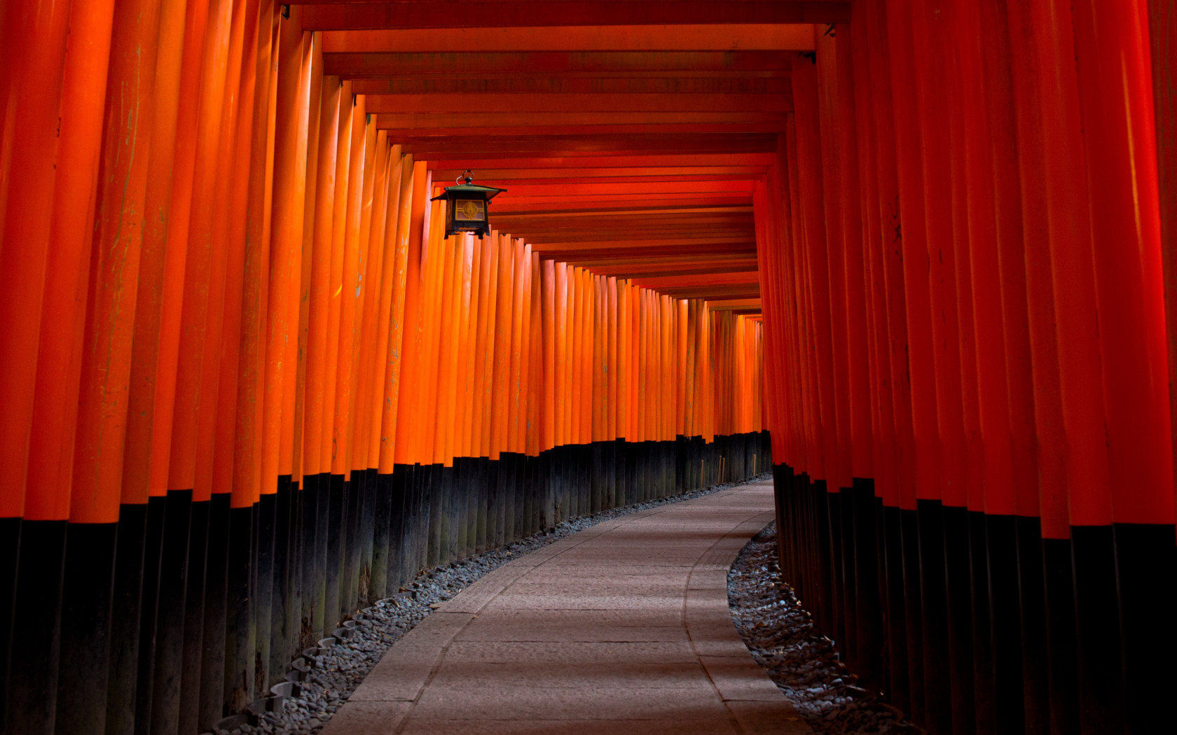 Gray Concrete Pathway Between Red-and-black Pillars