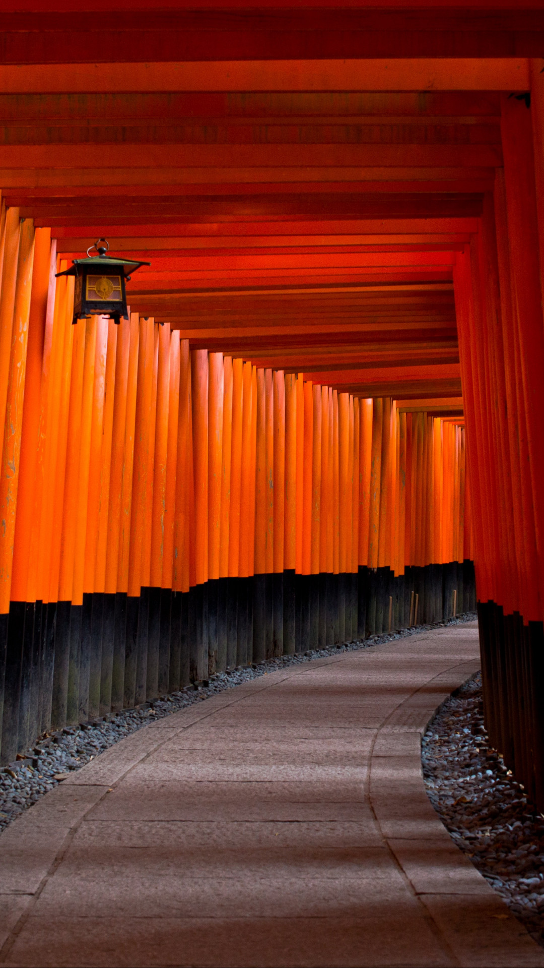 Gray Concrete Pathway Between Red-and-black Pillars