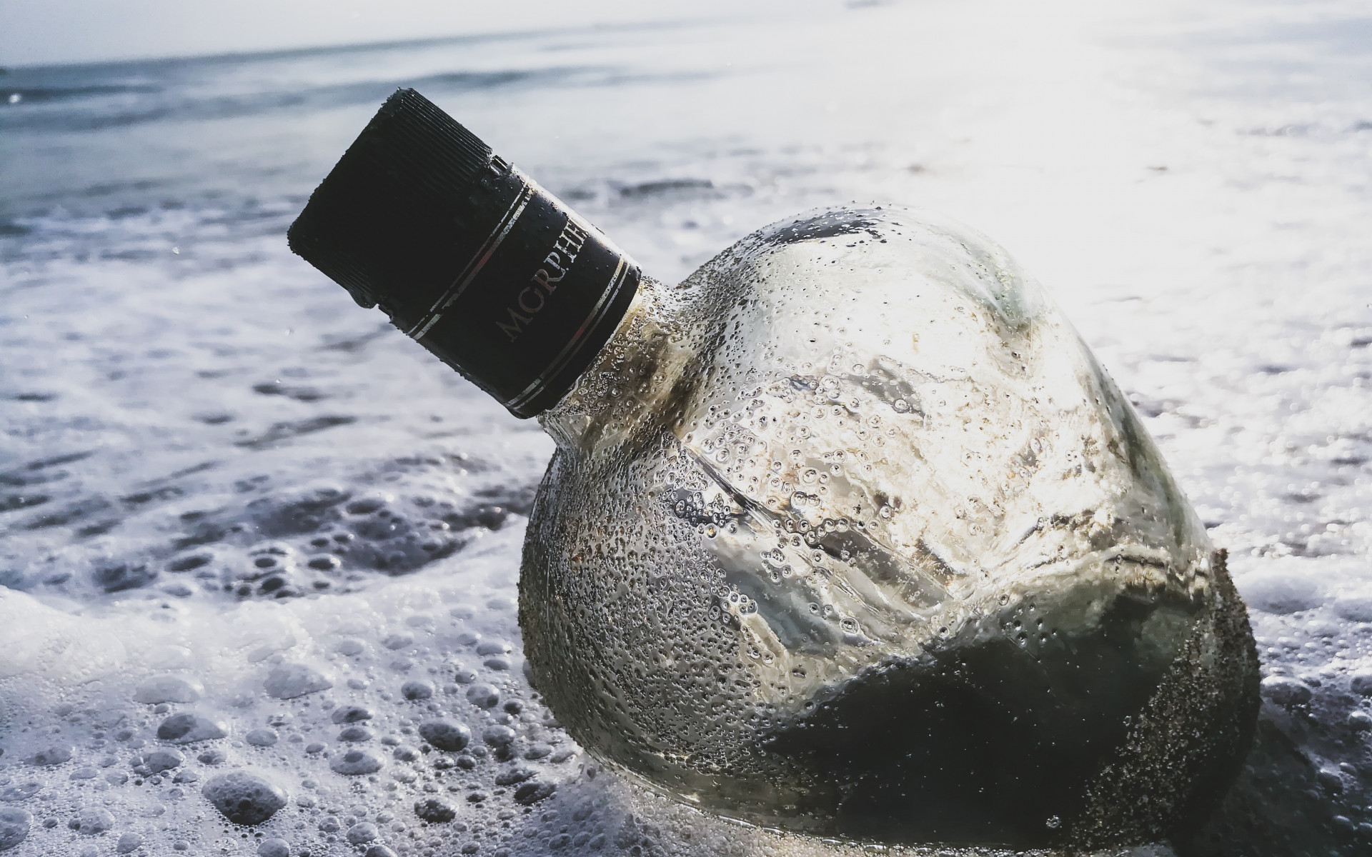 Glass Bottle in the Water