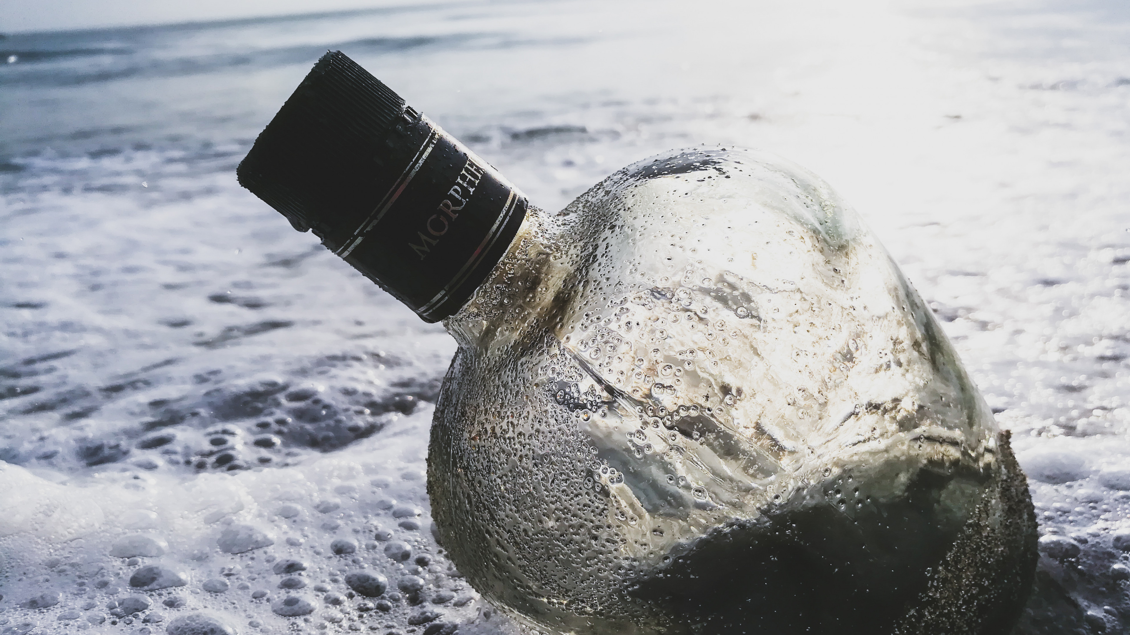 Glass Bottle in the Water