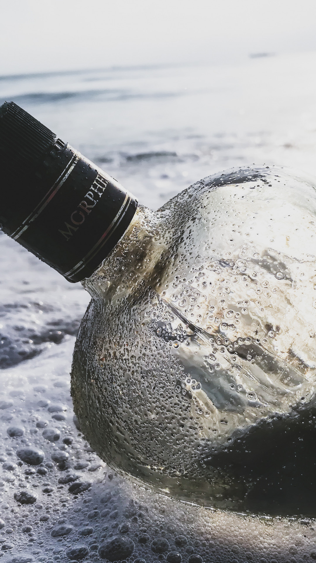 Glass Bottle in the Water