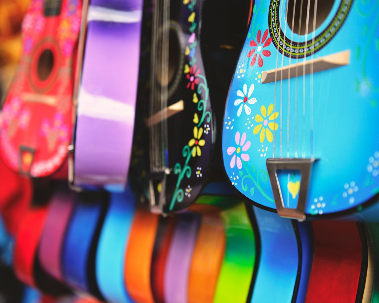 Blue, Purple and Green Acoustic Guitars