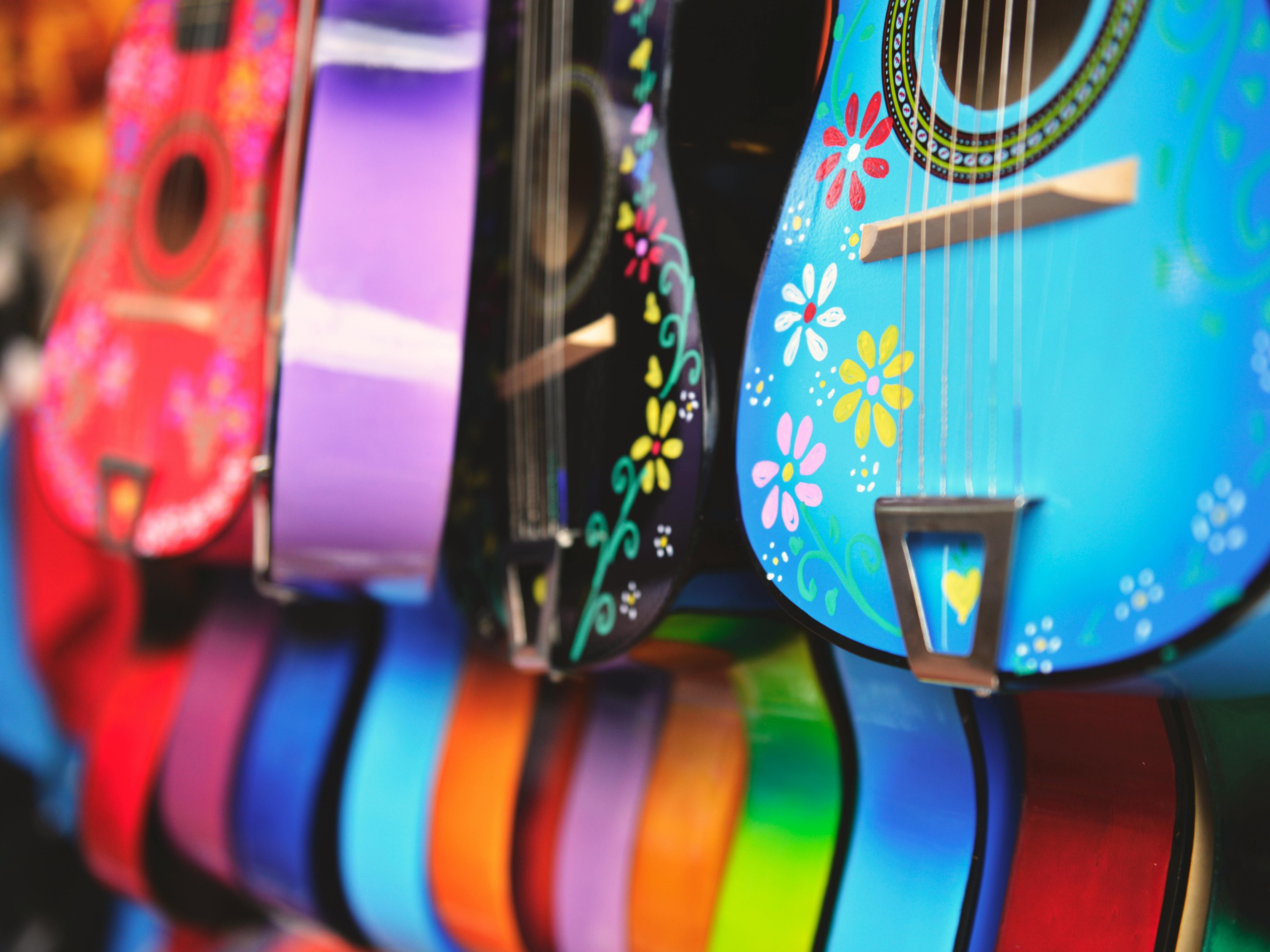 Blue, Purple and Green Acoustic Guitars