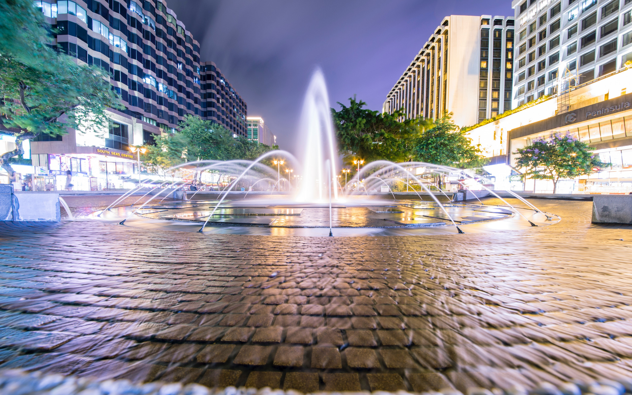 Fountain Surrounded by Trees and Buildings