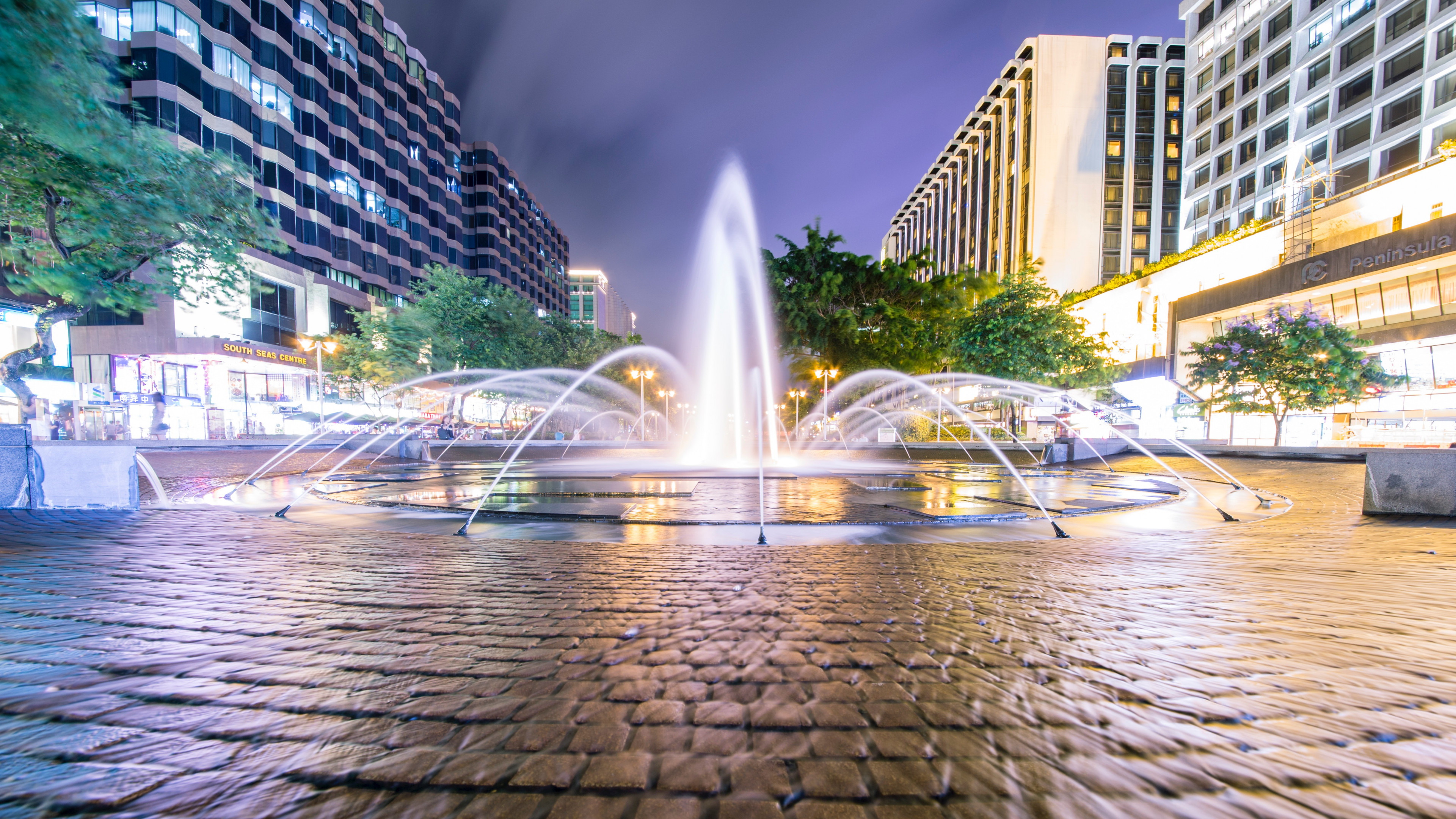 Fountain Surrounded by Trees and Buildings