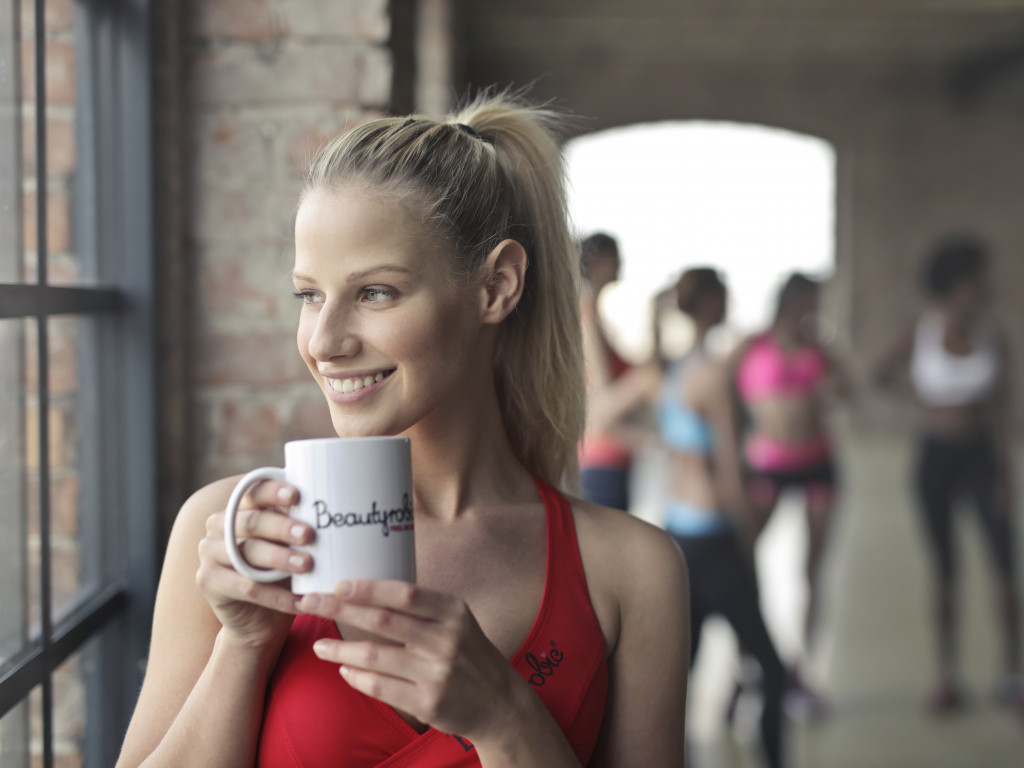 Woman Holding White Ceramic Mug