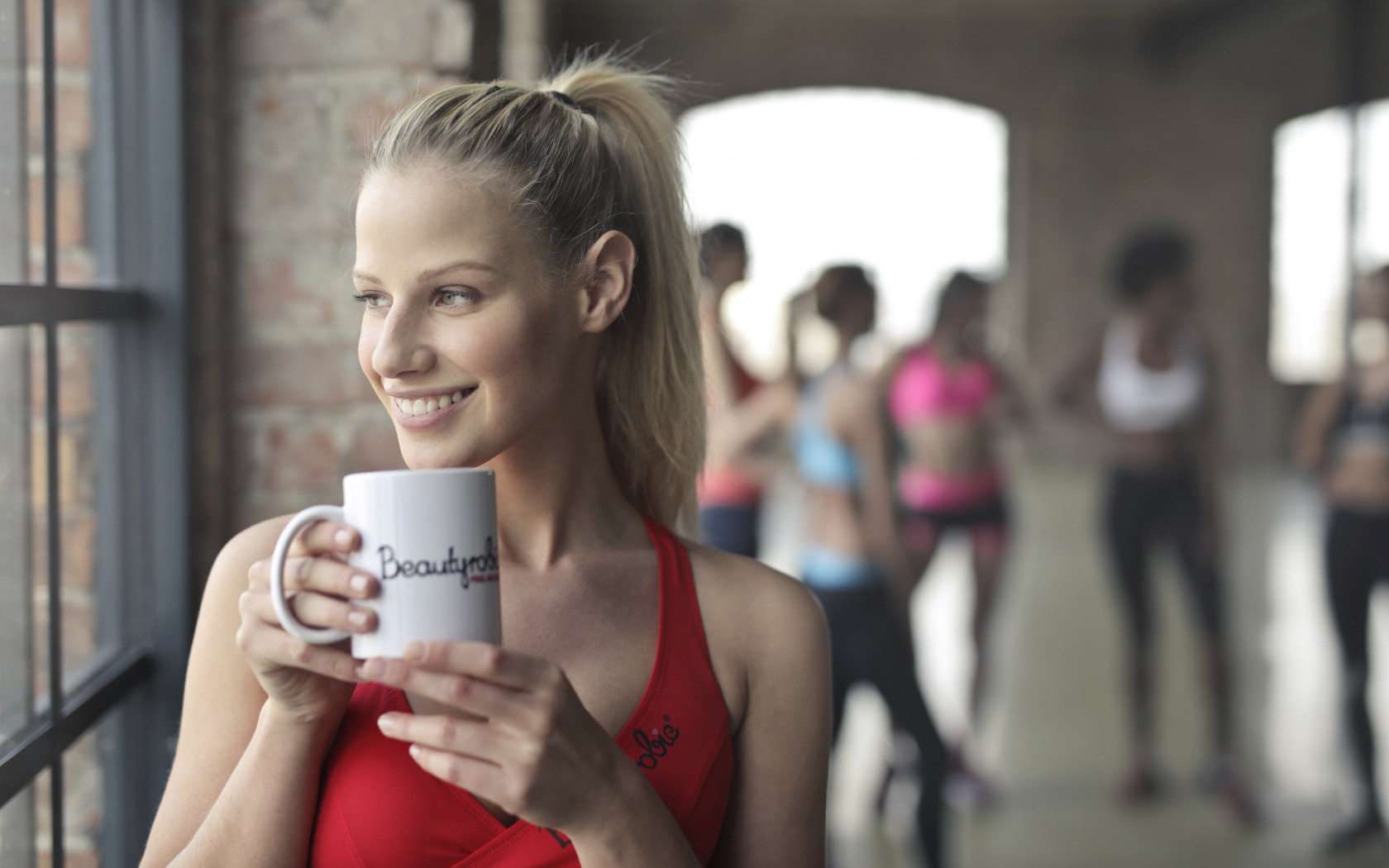 Woman Holding White Ceramic Mug