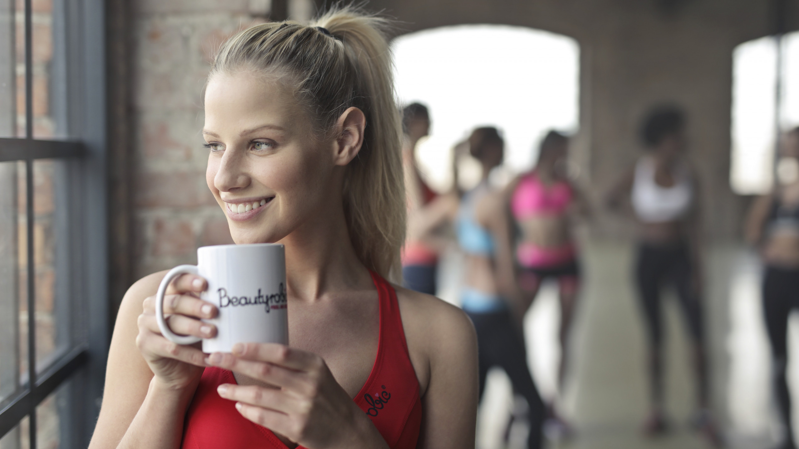 Woman Holding White Ceramic Mug