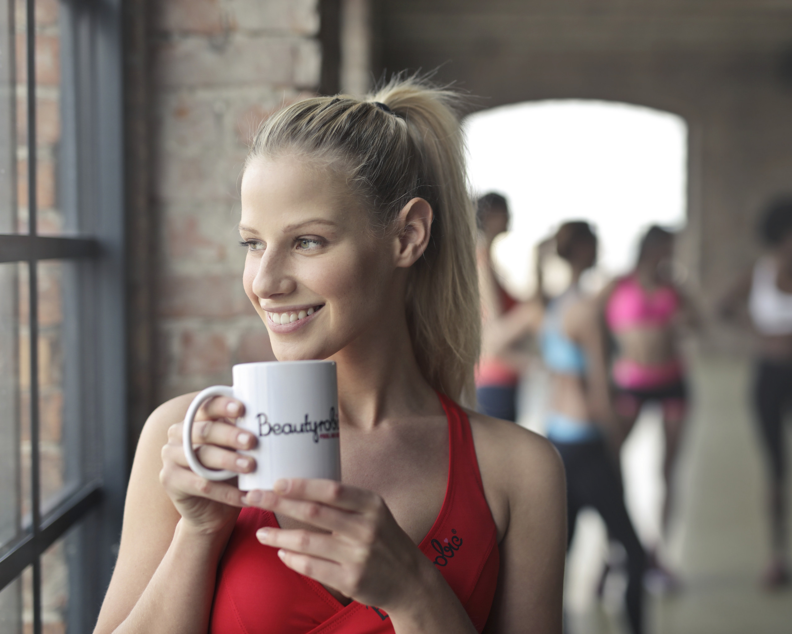 Woman Holding White Ceramic Mug