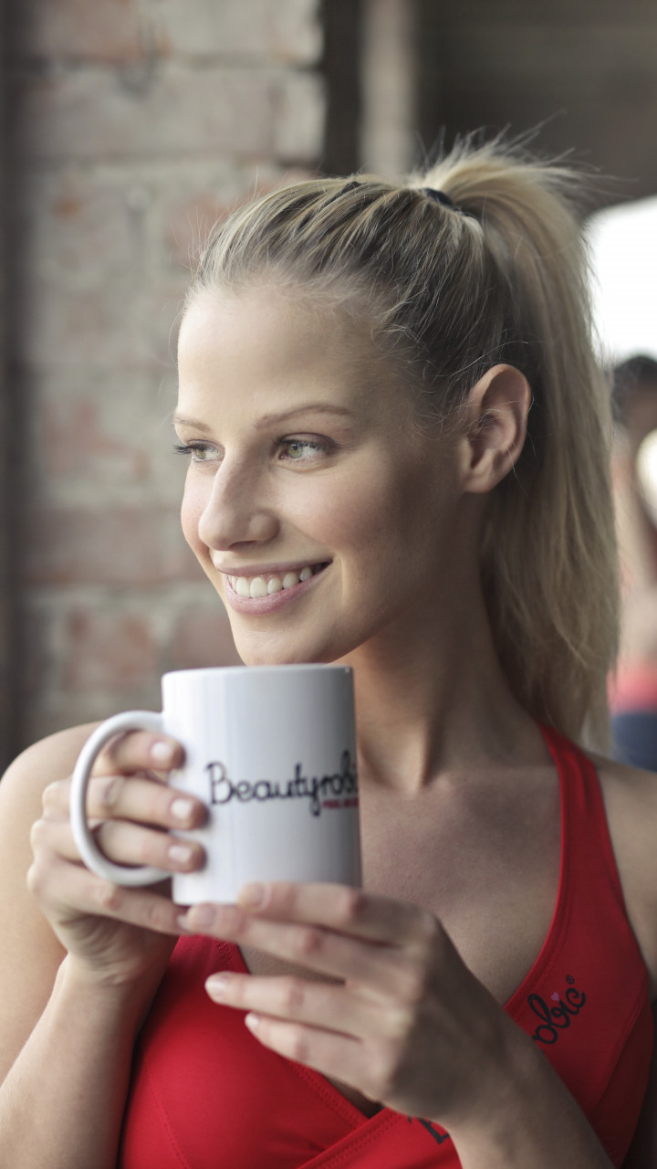 Woman Holding White Ceramic Mug