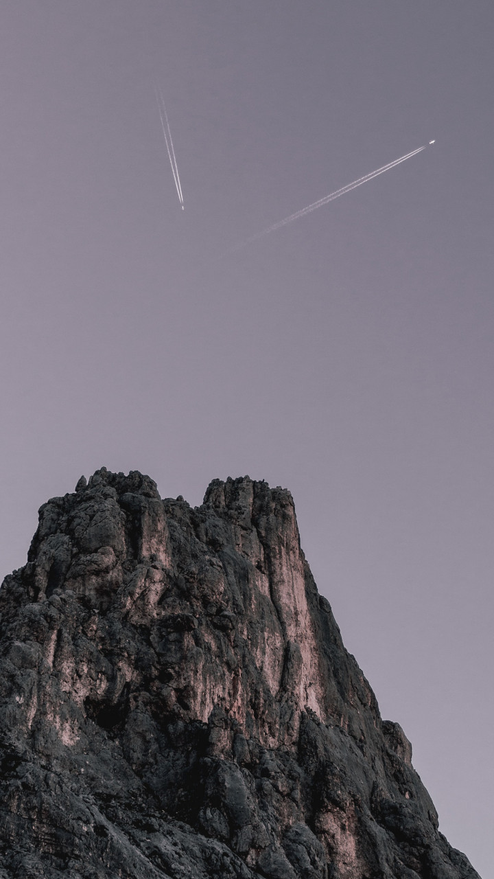 Two Planes Flying over Rock Formation 