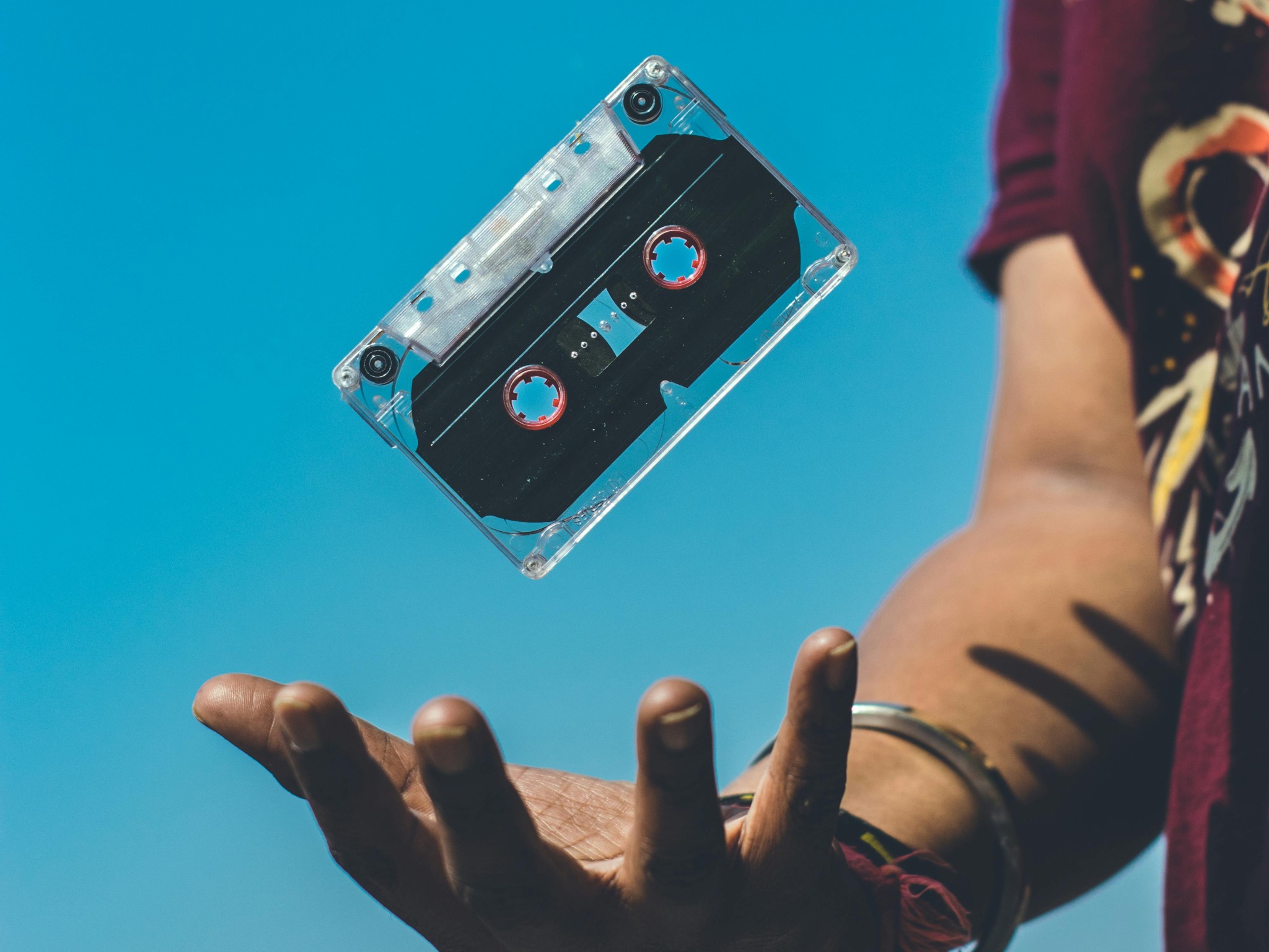 Person Doing Tricks on Cassette Tape