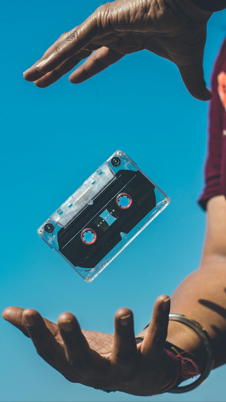 Person Doing Tricks on Cassette Tape